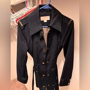 Woman’s Michaels Kors rain coat.